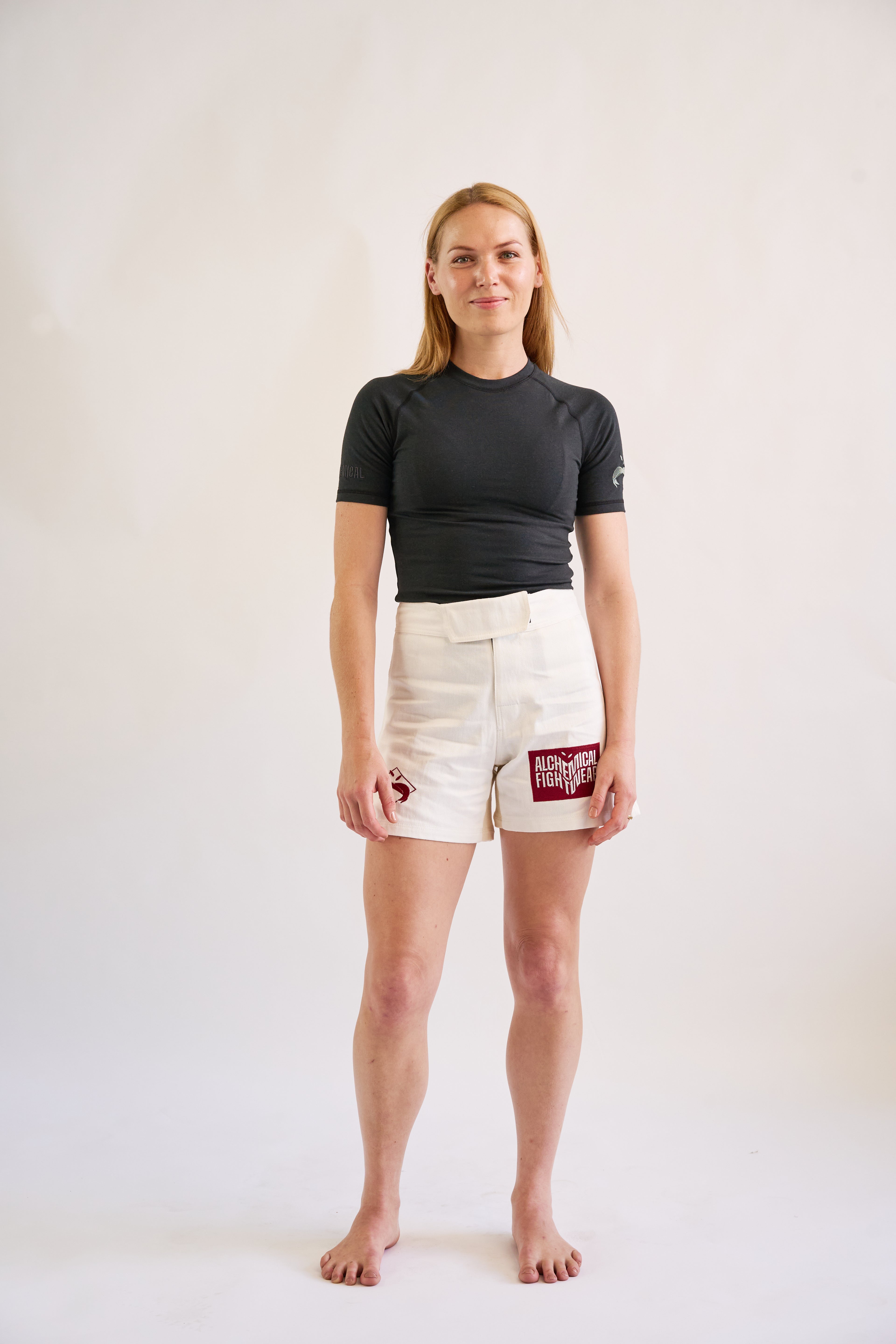woman wearing and black short sleeve hemp and organic cotton bjj rashguard