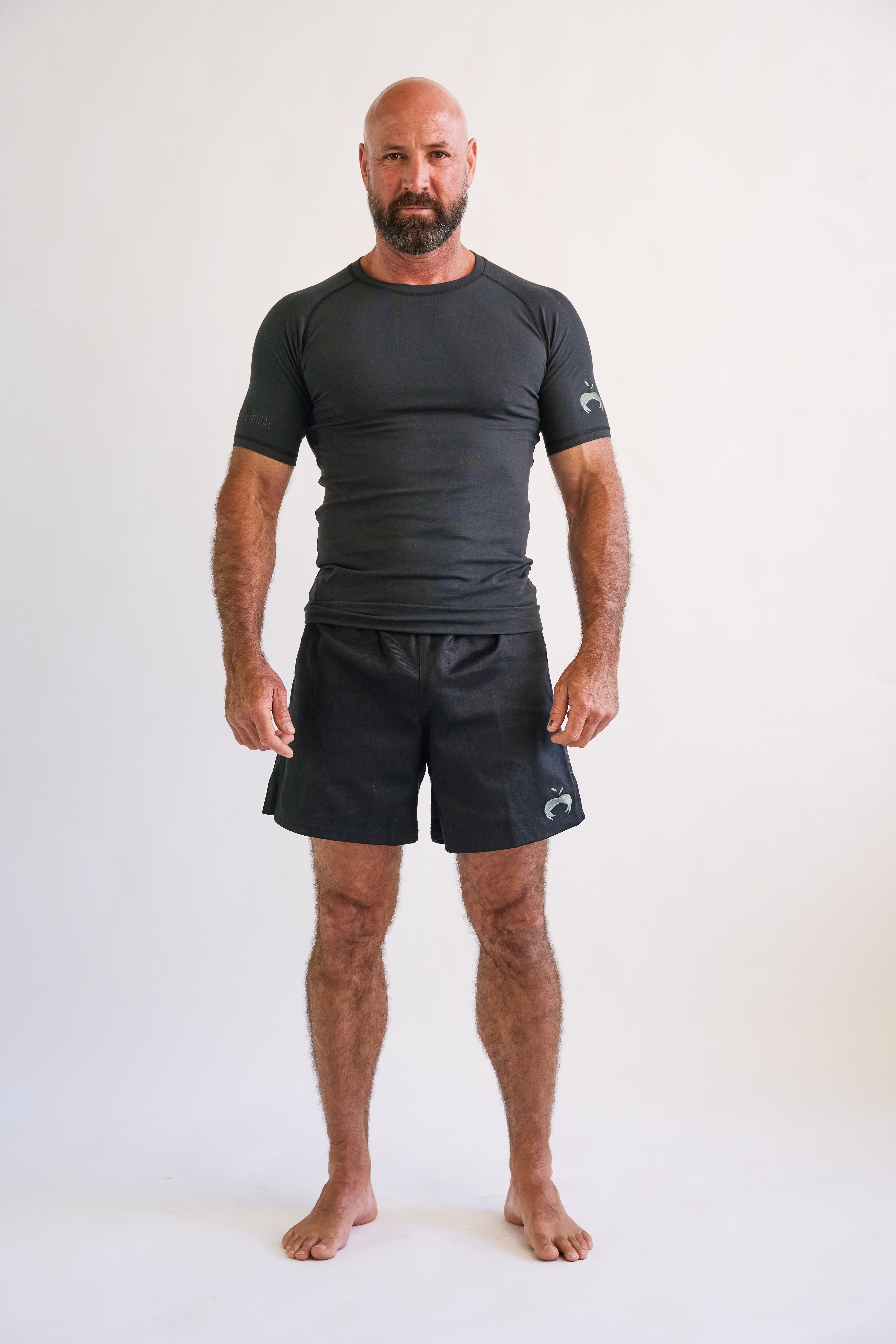man wearing and black short sleeve hemp and organic cotton bjj rashguard