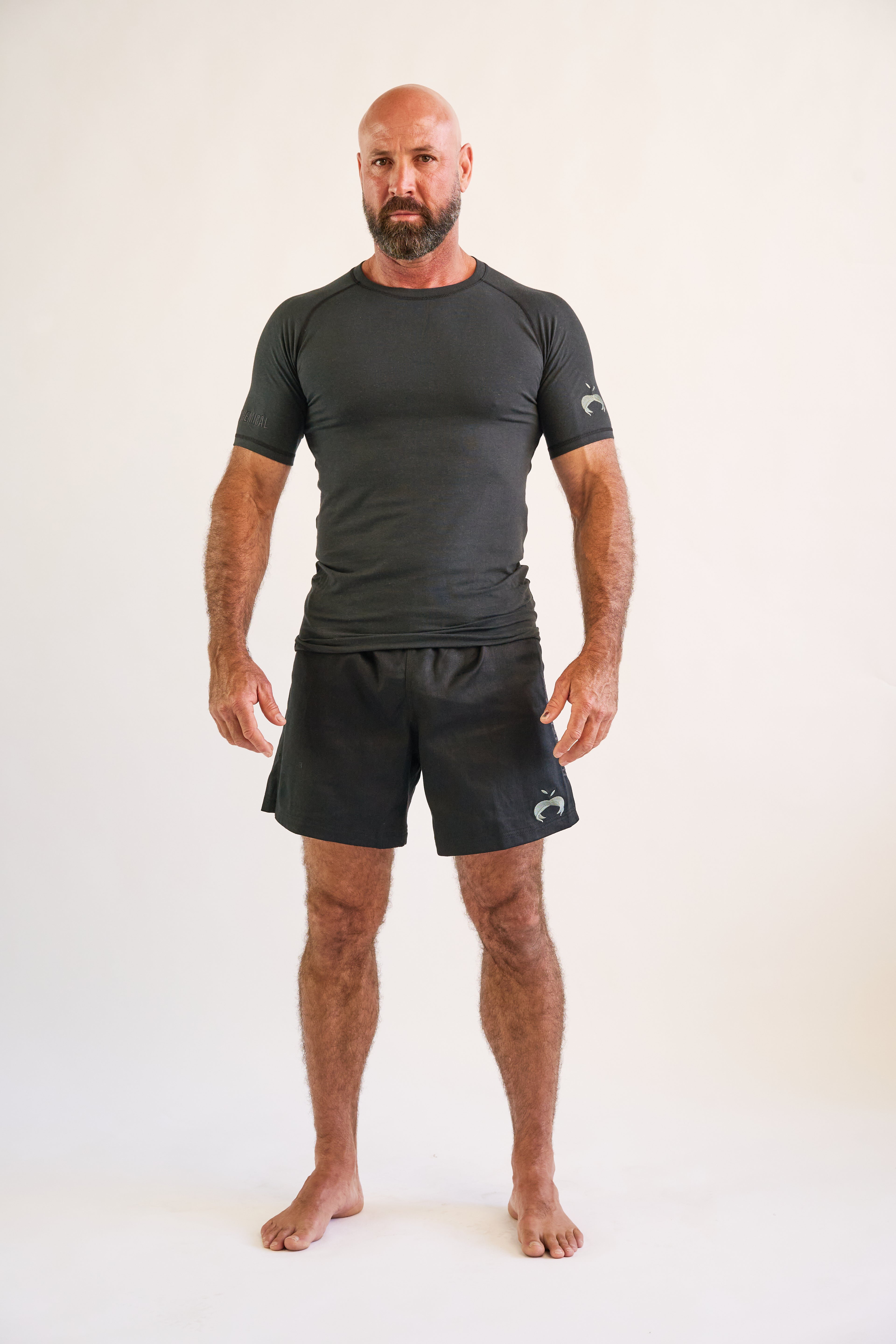 man wearing and black short sleeve hemp and organic cotton bjj rashguard