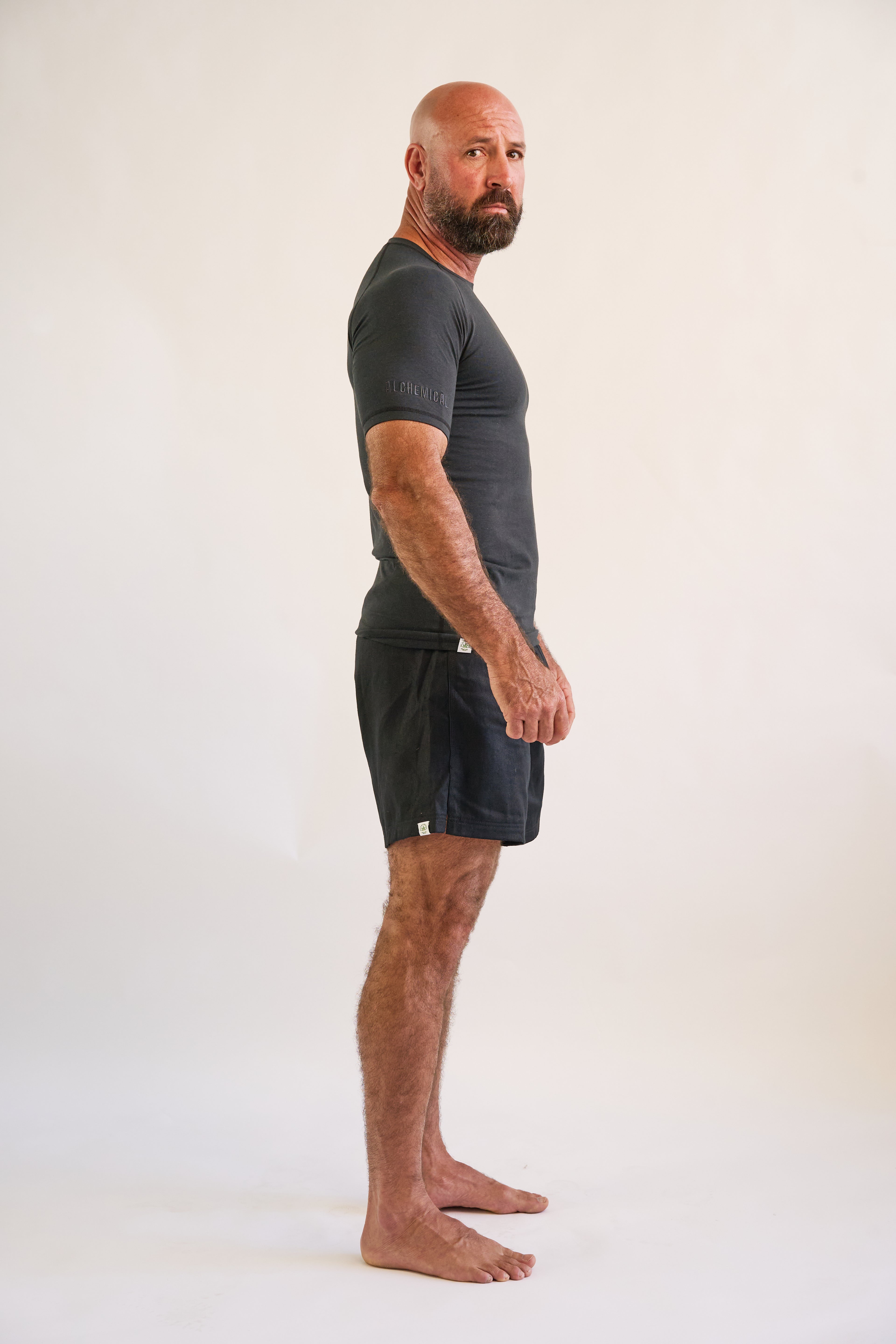 man wearing and black short sleeve hemp and organic cotton bjj rashguard