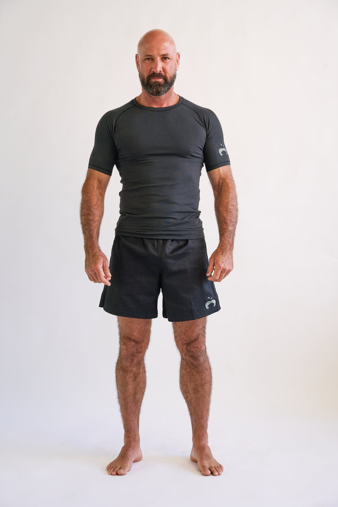 man wearing and black short sleeve hemp and organic cotton bjj rashguard